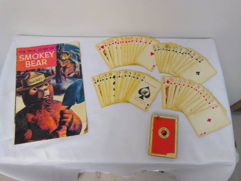 lot 32 image: The true story of Smokey the Bear (1969) and Burlington Northern vintage playing cards, all suits there, jokers are missing.