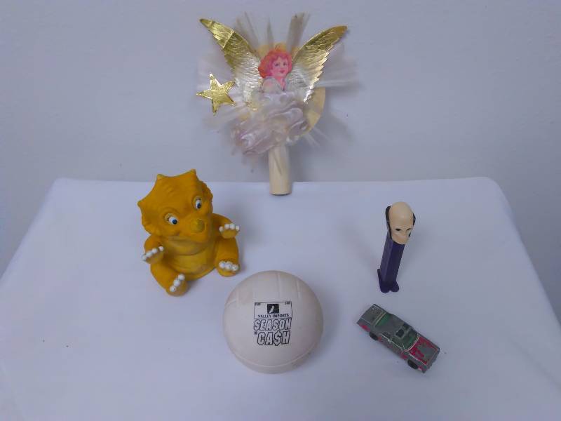 lot 34 image: Lot of Vintage Items, Christmas Tree topper, Dr. Skull Pez Dispenser, Valley Imports Soccer Ball, Matchbox car