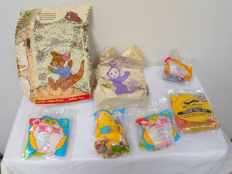 lot 48 image: Lot of 7 Happy meal toys (5) and 2 Bags. Toys new in sealed bag, Tele Tubby, Tiger