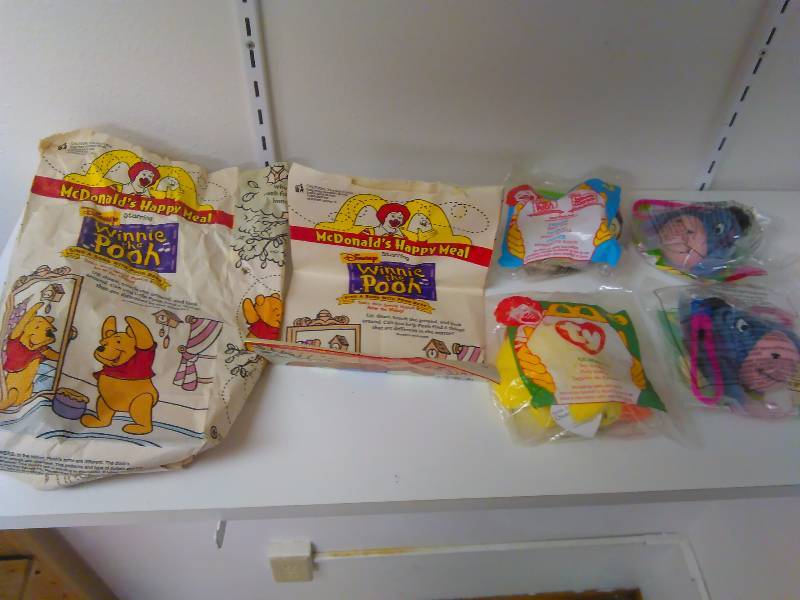 lot 49 image: Lot of 6  Happy meal toys and Bags. Toys new in sealed bag, Winnie, Tiger, Eeyore, and more
