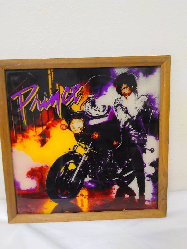 lot 53 image: Prince, Purple Rain, 1984, framed print