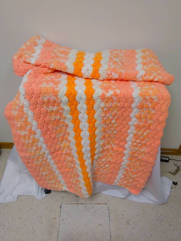 lot 144 image: Crocheted lap blanket, cream sickle orange and white