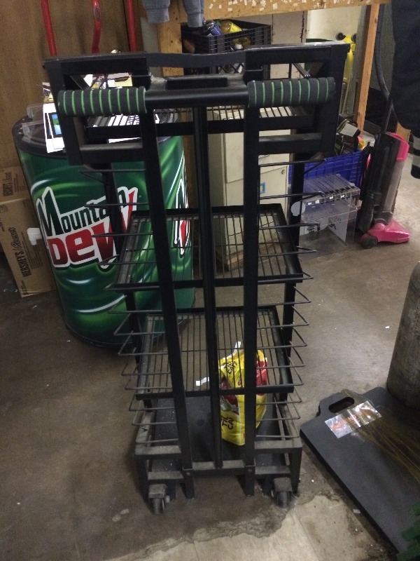 lot 63 image: Product Rack  wwheels   Measures 18 w x 15 d x 49 h