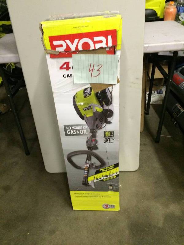 lot 43 image: Ryobi Expand It 4 Cycle 30 cc Trimmer Power Head never been used Stock and actual photos used to display item