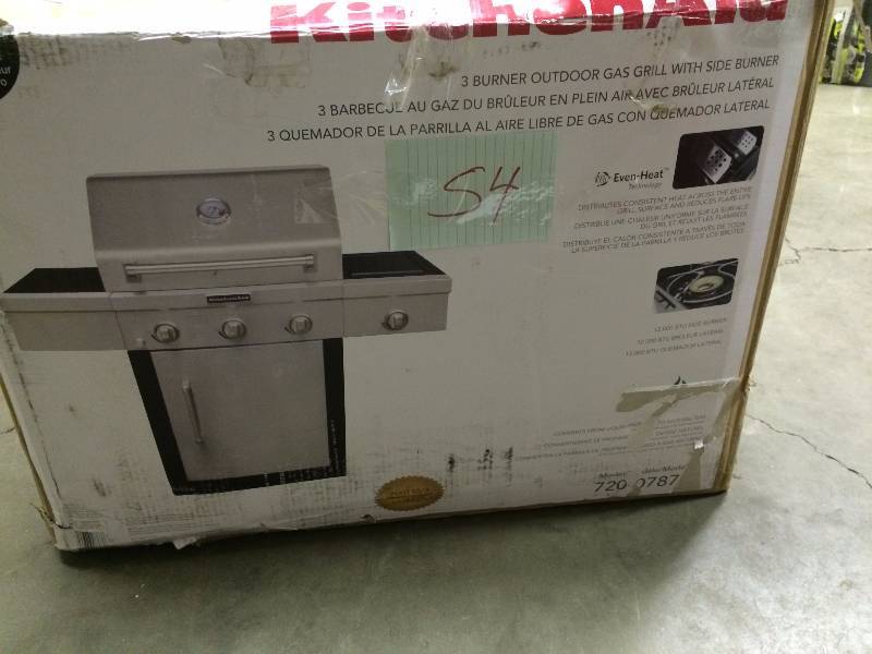 lot 54 image: Kitchen Aid 3-Burner Propane Gas Grill with Side Burner in Stainless Steel with Grill Cover- dent on the Top see pictures, item is in its origial Box- PLEASE REVIEW UPDATED DESCRIPTION DETAILS