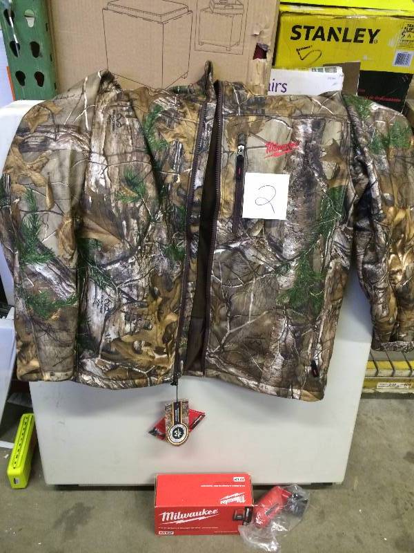 lot 2 image: Milwaukee M12 Cordless Lithium-Ion Camo Heated Jacket Kit (Battery and Charger Included) Medium Stock and actual photos used to display item