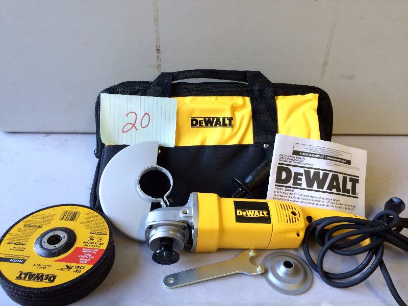 lot 20 image: Dewalt DW840K 7 inch Angle Grinder with Bag and wheels  Never been used Stock and actual photos used to display item