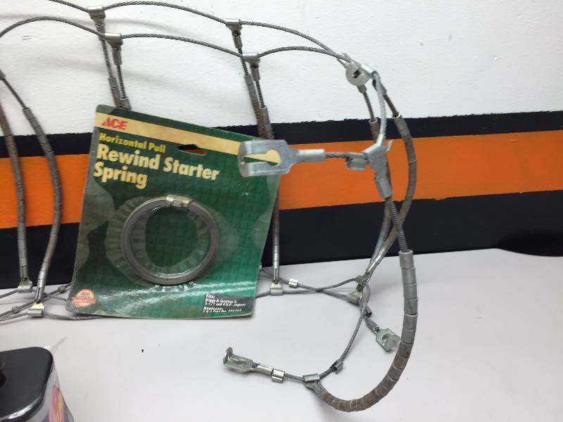 TIRE CHAN, 100 FT. EXTENSION CORD, FENCE STRETCHER, 2 6 VOLT BATTERIES, AND A TRIMMER