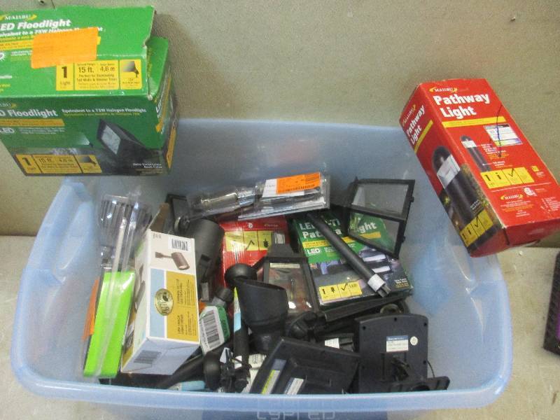 box of assorted outdoor lighting fixtures