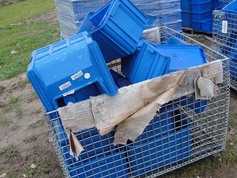 Pile of Blue Stackable Tubs with metal crate