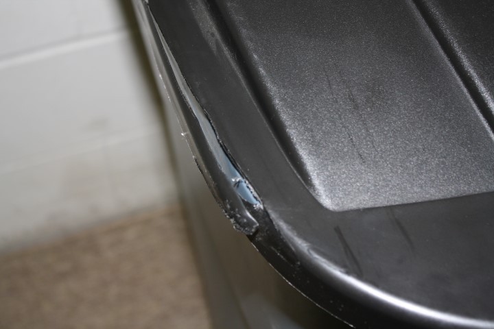 lot 31 image: Rubbermade 50-Gallon Rollout Trash Container