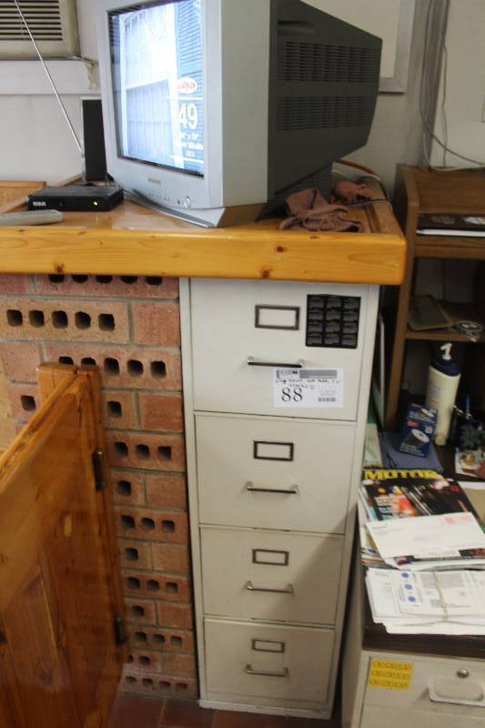 lot 88 image: 4-Drawer Metal File Cabinet, Wood End Table, Magnavox TV