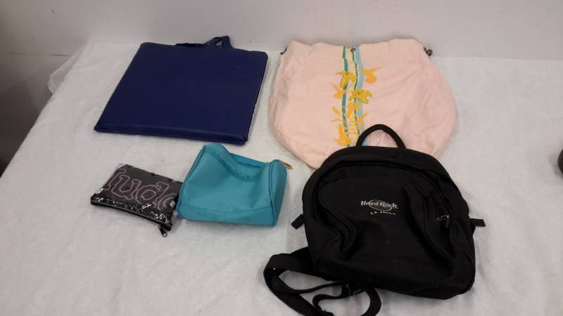 lot 12 image: Bag, cushion, backpack, and handbag