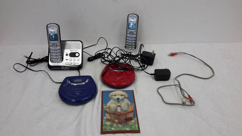 lot 15 image: Cordless phones, cd players, light switch cover