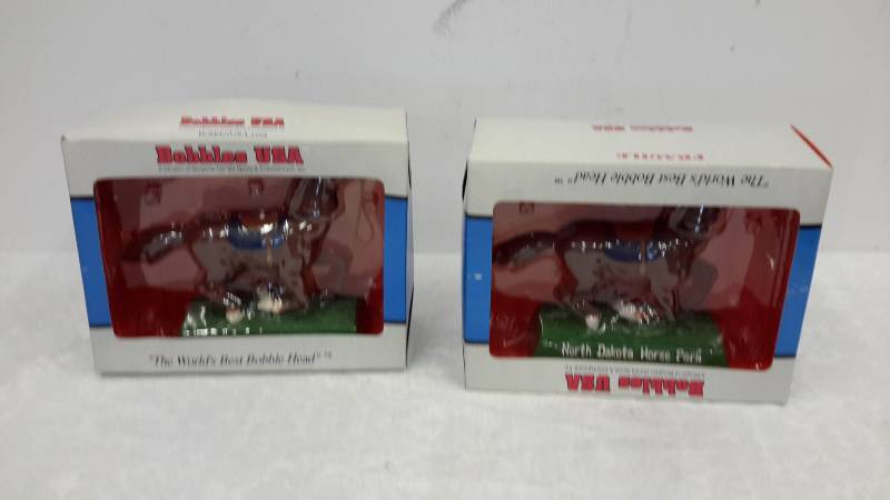 lot 28 image: In the box bobble head horses