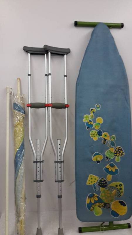 lot 93 image: Umbrella, crutches, ironing board