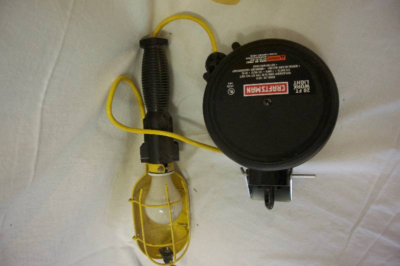 lot 54 image: Extension Cord & Retractable Garage Light