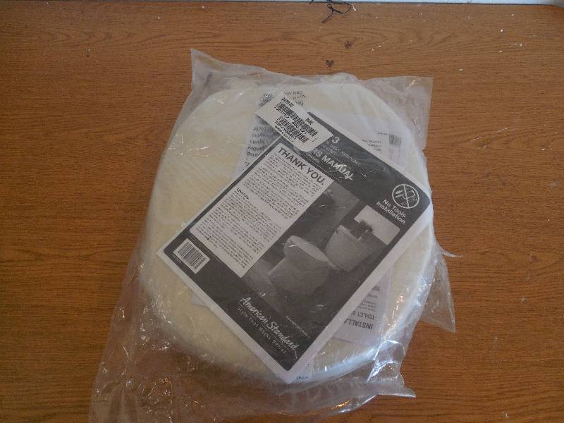 lot 64 image: AMERICAN STANDARD TOILET SEAT -