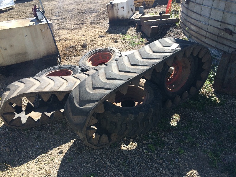 Bobcat Tracks & Tires   for Bobcat - S185    they look to be in pretty good condition     2 tracks and 4 tires