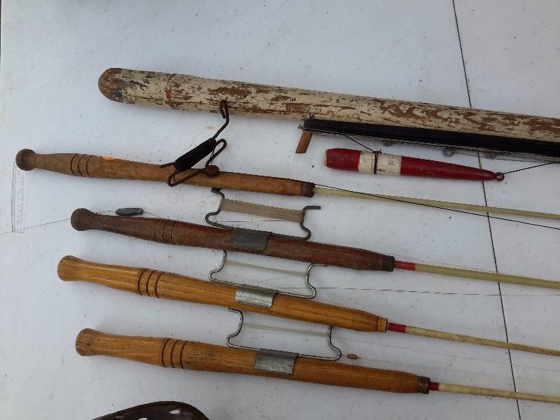 lot 55 image: ice Fishing rods and ice scoops