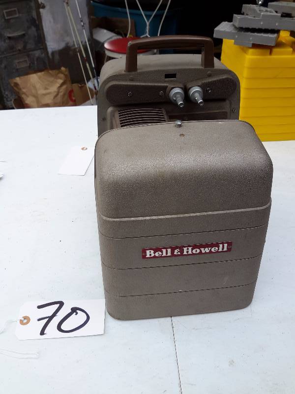 lot 70 image: Bell and Howell Projector. Tested and runs.. Light bulb good