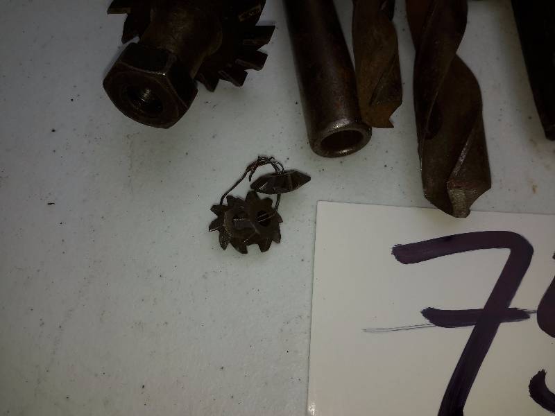 lot 75 image: Misc. Drill Bits as pictured.. Gas Can