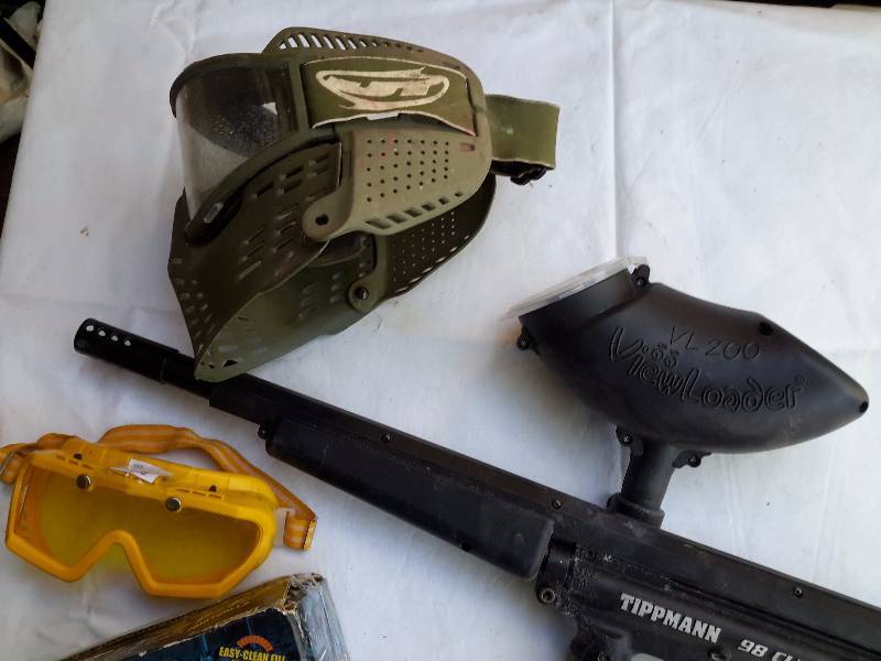 lot 28 image: Paintball Gun, mask accessories.. Includes a partial box of paint balls