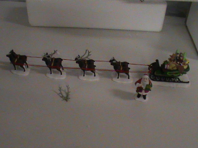 Dept. 56 - Sleigh and 8 tiny reindeer and Standing Santa