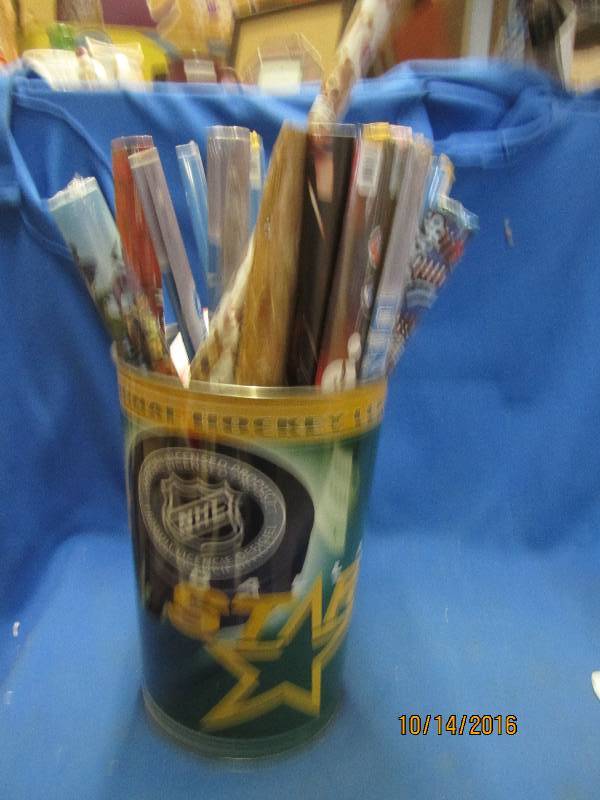 Metal can of movie posters, include...