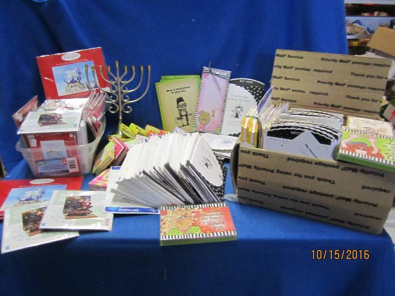 Bin of designer cards magnets and m...