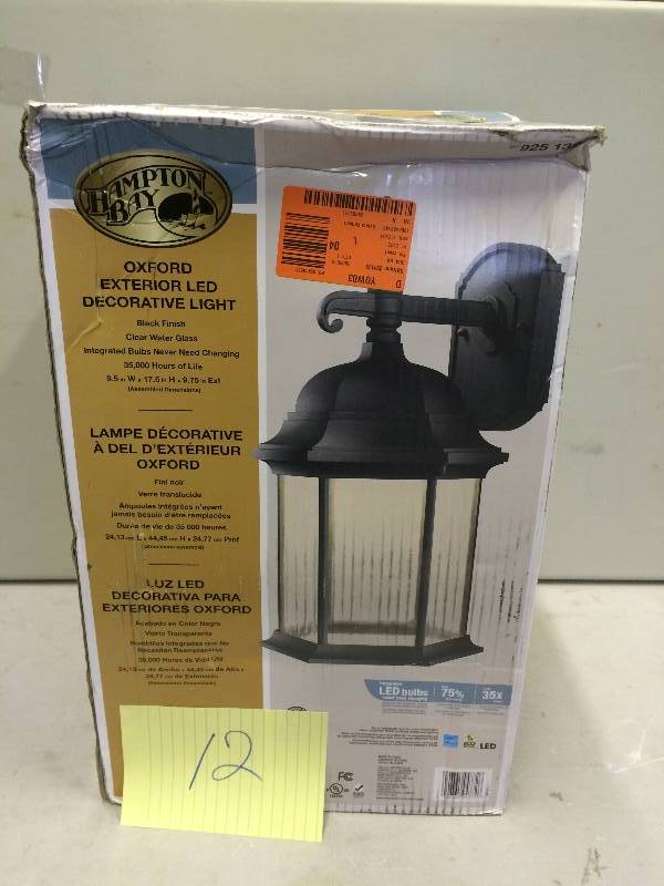 lot 12 image: Hampton Bay  Oxford Collection Black Outdoor LED Wall Lantern Dimensions 9-12 in. W x 9-34 in. D x 17-12 in. H , in Original Box never been used Stock and actual photos used to display item