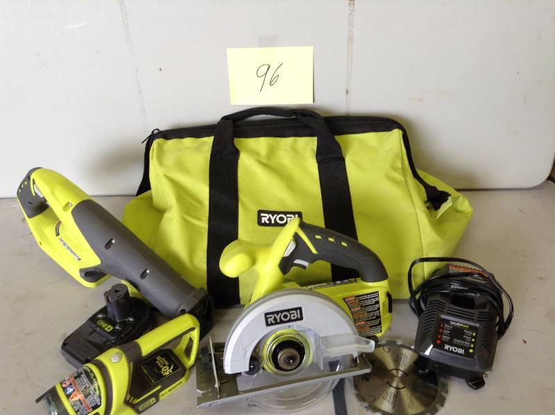 lot 96 image: Ryobi One 18V Cordless Tools - Set of 3 , 1 Battery and Charger included - Light, Circular Saw, Reciprocrating Saw Never Used