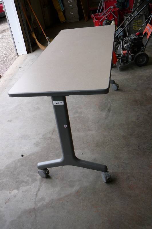 lot 24 image: Table on wheels