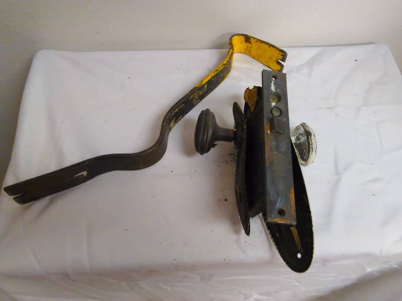 Vintage doorknob and latch and crowbar