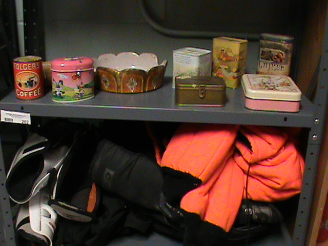 lot 202 image: Hockey gear and orange deer hunting jacket