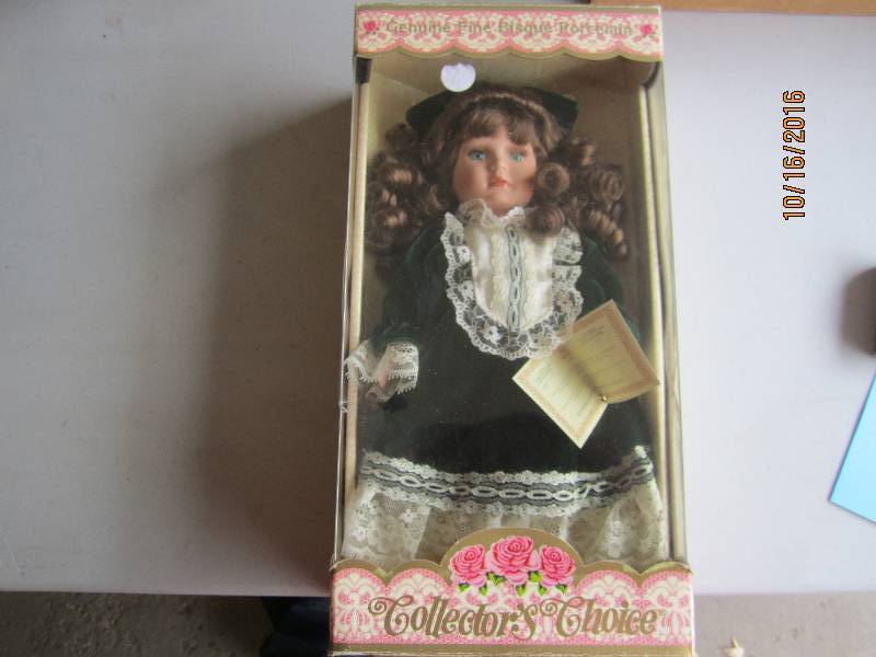 Porcelain doll in box...