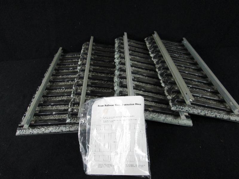 lot 119 image: 4 Track Sections For Jim Beam Train Decanters