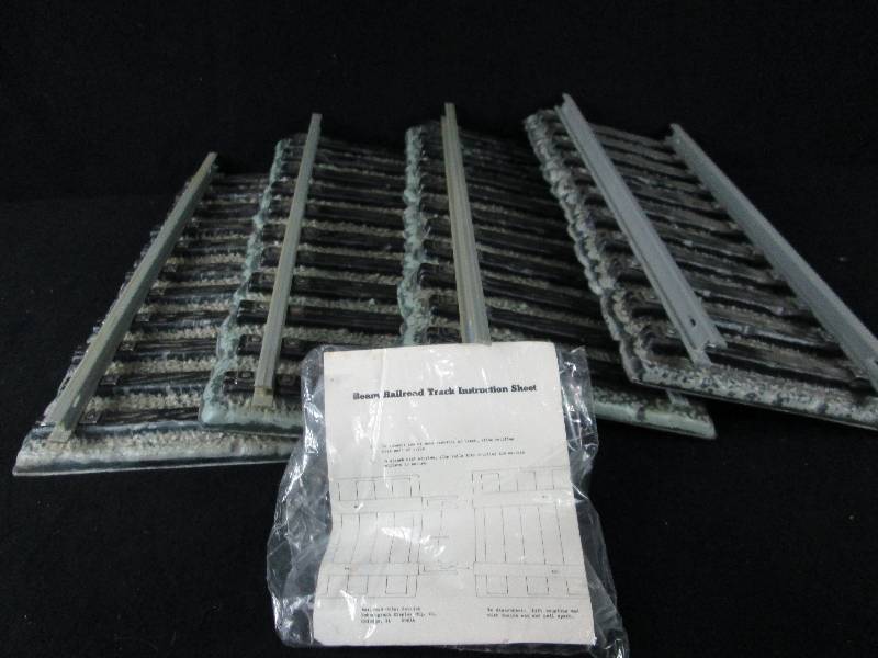 lot 120 image: 4 Track Sections For Jim Beam Train Decanters