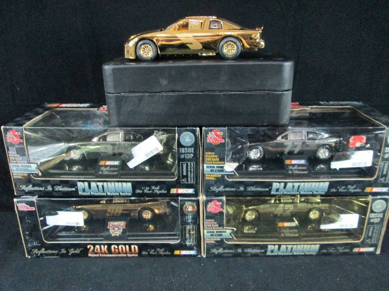 lot 215 image: 1- 24 Scale Collectable Platinum & gold Nascar Cars