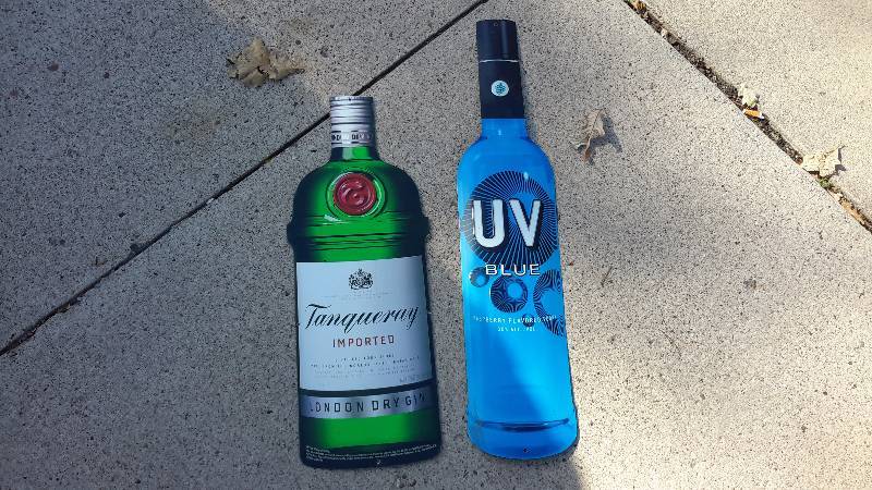 Aluminum Tanqueray imported bottle sign and UV blue bottle sign.