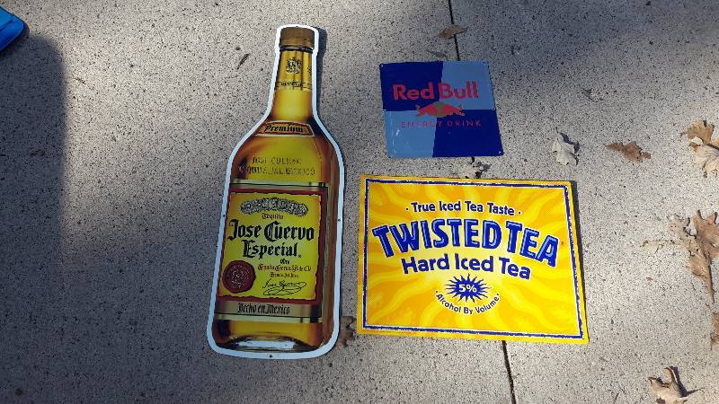 Aluminum is a Jos Cuervo speciality, Twisted Tea, and Red Bull signs.