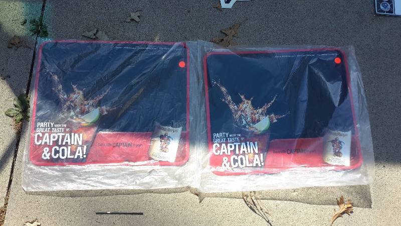 One pair of aluminum Capt. Morgan signs-new