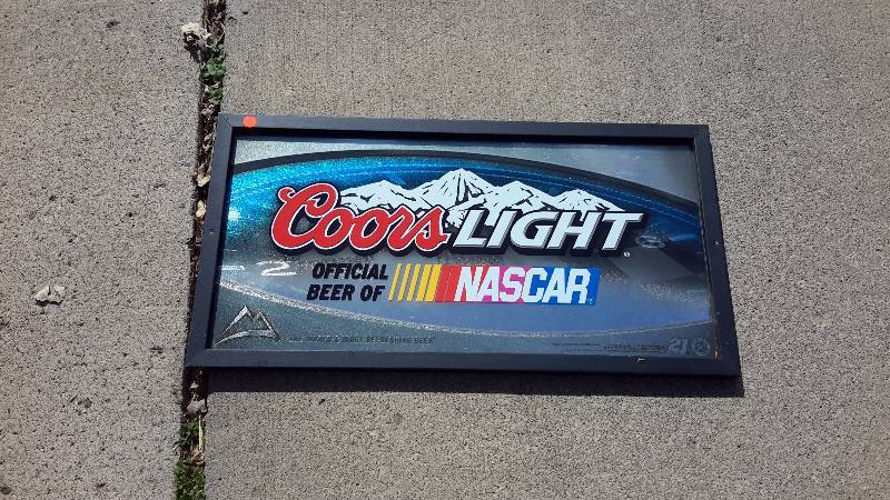 A framed Coors light official beer of NASCAR sign from 2008.
