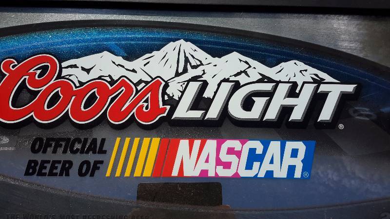 A framed Coors light official beer of NASCAR sign from ...