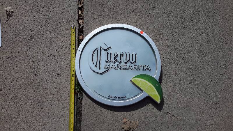A framed circle sign for Cuervo Margarita from 2008.
