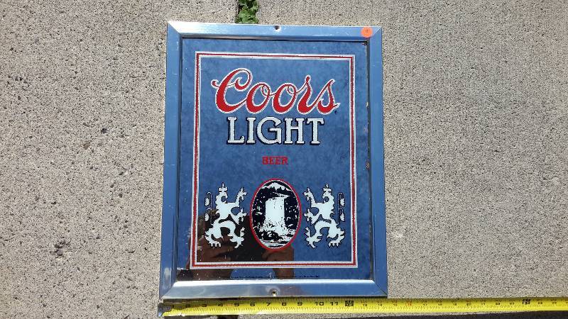 A framed Coors Light mirror