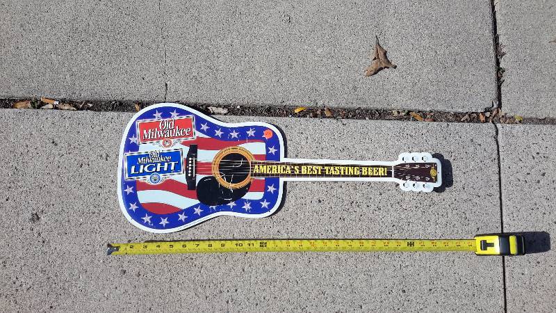 Old Milwaukee aluminum guitar shaped sign from 2002