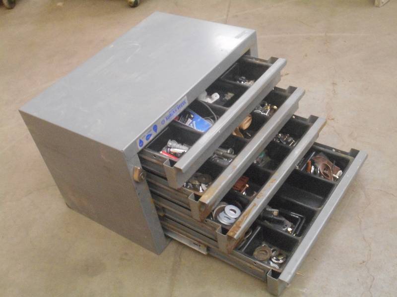 lot 10 image: 4-Drawer Storage Unit Full Of Assor...