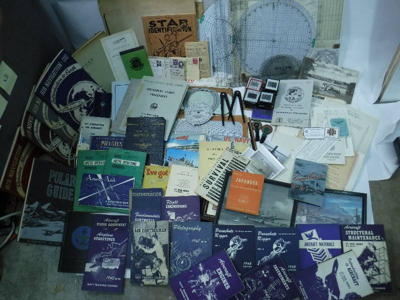 lot 79 image: Huge Lot of WWII Navy Books, Documents, Pictures, Manuals, Slides, Navigational Tools, Etc.