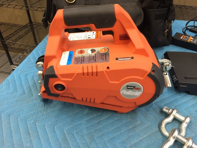 lot 5 image: PullzAll Winch  MN 885005 (24 Volt Cordless)  Complete with batteries, (need new batteries)  bag, charge cord